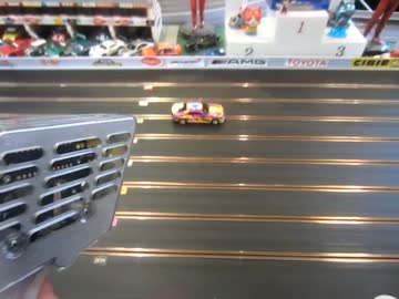 博品館のスロットカーと大人のプレミアムスティック(激辛ハバネロ味)