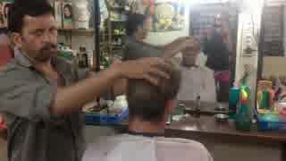 Traditional Indian head massage in barber shop