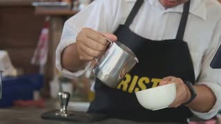 Barista Pouring Milk Into Coffee Cup アセアンファーム合同会社