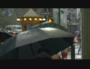 People Walking Through Rain Under Umbrellas　上村憲司