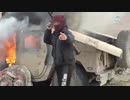 Islamic state fighter destroying a sdf humvee