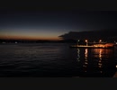 火が沈む。夜の海。