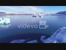Beautiful aerial over icebergs in the Arctic Jokulsarlon glacier lagoon in Iceland　石川崇弘