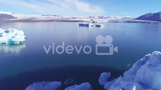 Beautiful aerial over icebergs in the Arctic Jokulsarlon glacier lagoon in Iceland　石川崇弘