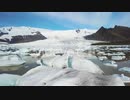 Slow aerial across the massive glacier lagoon filled with icebergs at Fjallsarlon 　石川崇弘