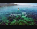 An aerial shot over a paddle boarder rowing on Lake Tahoe　石川崇弘