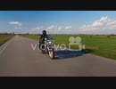 Travel Dream - Biker Rides Along A Country Road On A Background Of Blue Sky And Green Fields　沖田清