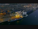 The glowing lights from a crane and ship at the Port of Oakland at nighttime　安孫子佳典