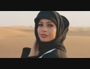 Close Up Portrait Of A Beautiful Muslim Woman Wearing Hijab And Looking At Camera In A Windy Desert