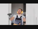 a man in the shape of a repairman shoots a drill