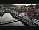 Aerial view of Lucerne, Switzerland at sunset while crossing Kappelbrücke bridge towards Altstadt