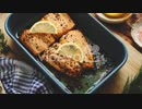 Roasted salmon in heat proof dish With aromatic dill lemon salt and pepper on sides