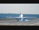 mixkit-airplane-landing-rear-view-7477-large