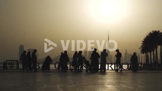 Family Of Tourists Visit Dubai Creek Harbour Overlooking Famous Dubai Skyline