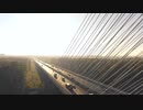 A convoy of vehicles traveling on a bridge