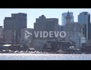 Establishing skyline of Boston Massachusetts with sparkling waterfront in foreground