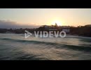 Uluwatu bali island surfer spot, aerial view of waves in clean water ocean at sunset