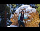 Girl womanstanding with red rocks formation and snow near Bryce Canyon in southern Utah