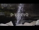Waterfall with dark background and granite rocks