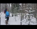 Pirunkirkko and simonlampi signs in winter forest in Finland, people walking