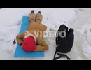 Small child ice fishing on the frozen river in winter in Norway, View from above