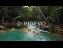 Waterfalls in tropical jungle scenery, water cascading in rainforest, 4K aerial