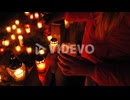 Graveyard, candles are lit on the grave at night