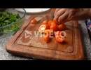 Fresh Cherry Tomatoes Slice In Wooden Board
