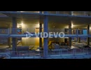 Flight around construction site, illuminated structure of new high rise building