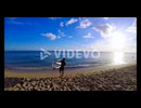 Surfer with surfboard surfing in sea water 4k
