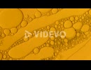 abstract oil drops background in golden liquid for cosmetic treatments Hydroge