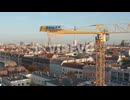 Rising above yellow construction crane