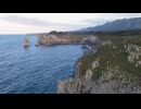 Aerial View Of Sea Waves Breaking On Rocky Coastline