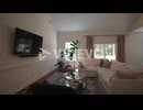 Beautifully designed living room with an open concept kitchen and vaulted ceilings