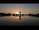a man practicing yoga in the beach on a beautiful sunset