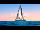 Cartoon animation of sailing sailboat at sunset or sunrise