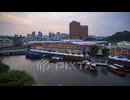 Time-lapse of the night view of a boat pier with boats coming and going