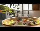 Adding Olive Oil to Salad in Bowl
