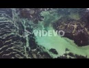 Aerial drone footage of the sea and the coral reef at sunset in Lanzarote island, Spain