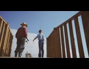 Bottom view of a grandfather and his grandson fishing from a wooden bridge in a lake