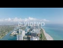 Aerial panoramic footage of tall modern buildings in urban borough on sea coast