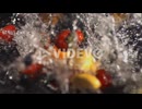 Fruits falls into a container of water