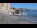 Tourists Sunbathing On The Sandy Shore Of Calahonda Beach In Nerja,