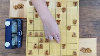 将棋　リアル一手30秒将棋33（後手、奥側）四段　東畑直希（石田流三間飛車～片美濃）対　五段　門屋良和（居飛車～角交換～左美濃）　