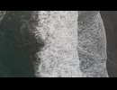 aerial view of waves crashing ashore
