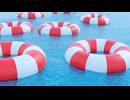 Red and White Life Preservers Floating on Water