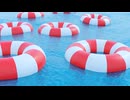 Red and White Life Preservers Floating on Water