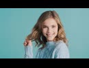Teenage Caucasian girl laughing at the camera.