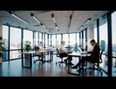 Professionals Working on Laptops in a Modern Office with City Views
