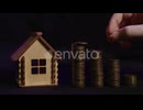 The Severity of the Repayment of a Mortgage or Loan a Man with Shaking Hands Puts a Coin in a Stack
